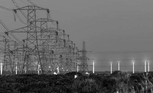 Pylons from dungeness b leading to wind farm