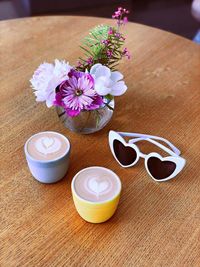 High angle view of purple roses on table