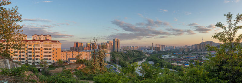 High angle view of buildings against sky during sunset