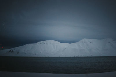 Scenic view of sea against sky at night