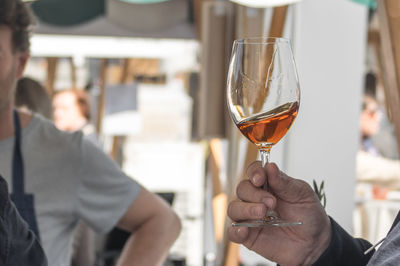 Close-up of a man tasting wine