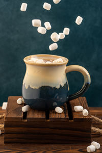 Close-up of coffee cup on table