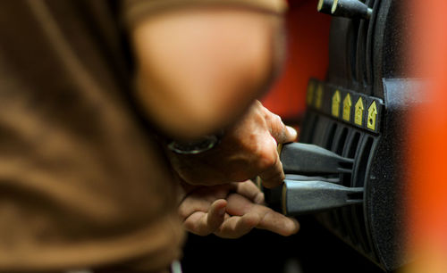 Close-up of man using smart phone