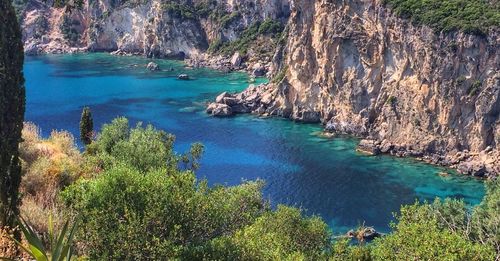 Scenic view of sea with rocks in background