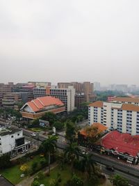 High angle view of buildings in city against sky