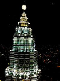 Low angle view of modern building at night