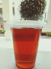 Close-up of red drink on table