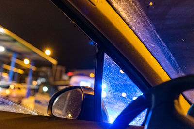 Close-up of illuminated car in city