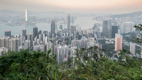 High angle view of modern buildings in city against sky