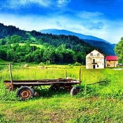 Tractor on field against sky