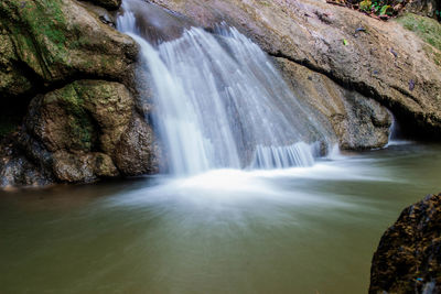 Scenic view of waterfall in forest