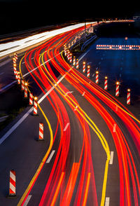 A motorway construction site at night and heavy traffic