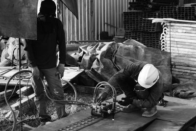 People working on street in city