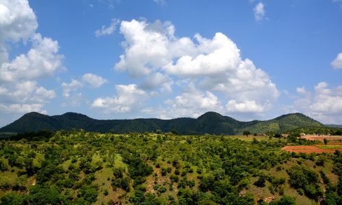 Scenic view of mountains against cloudy sky