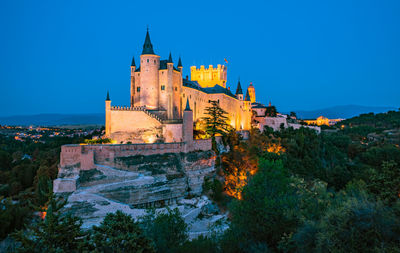 Low angle view of historical building against blue sky