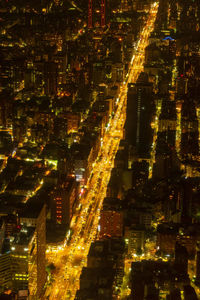 High angle view of illuminated buildings in city at night