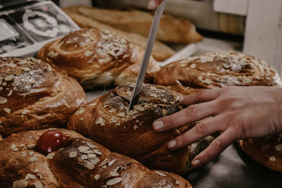 Cropped hand of person preparing food