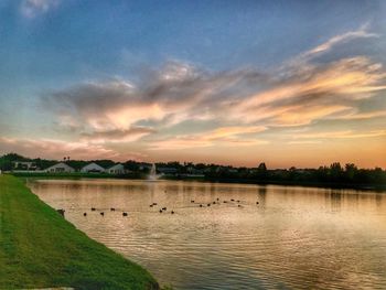 Scenic view of lake against sky during sunset