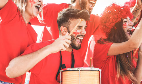 Cheerful fans screaming outdoors