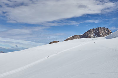 Scenic view of snowcapped mountain against sky