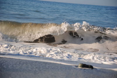 Scenic view of sea against blue sky