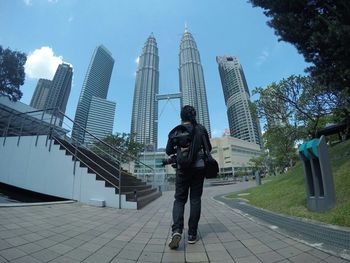 Woman standing in front of modern building