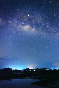 Scenic view of star field against sky at night