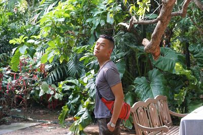 Man standing by trees