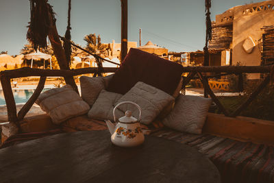 Close-up of chairs on table