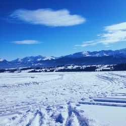 Scenic view of snowcapped mountains against sky