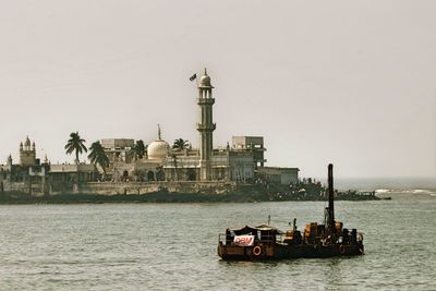 Ship in sea against clear sky