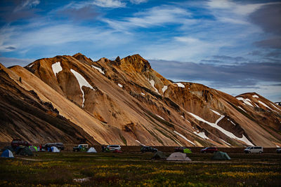 Scenic view of mountain against cloudy sky