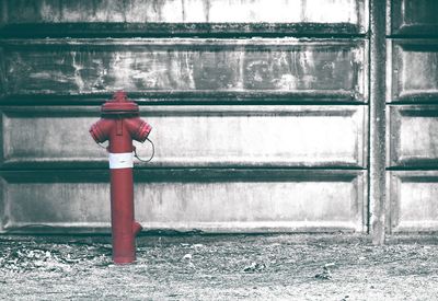 Close-up of fire hydrant by sea