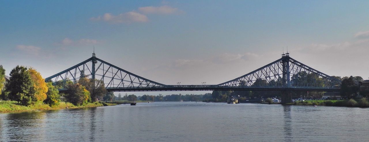 connection, bridge - man made structure, water, built structure, architecture, waterfront, river, sky, bridge, engineering, tree, cloud - sky, transportation, cloud, nature, tranquility, lake, tranquil scene, outdoors, no people