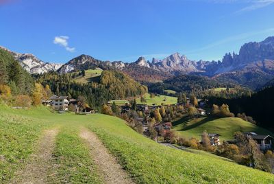 Scenic view of landscape and mountains against sky