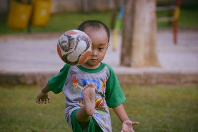 Boy playing on field