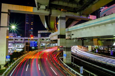 High angle view of light trails on road at night