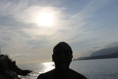 Portrait of man in sea against sky