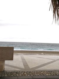 Scenic view of beach against clear sky