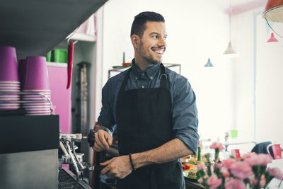 Barista preparing coffee in cafe