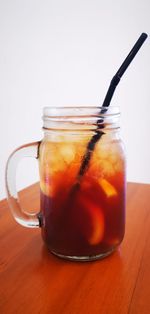 Close-up of drink in glass jar on table