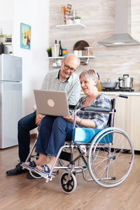 Two people sitting on floor