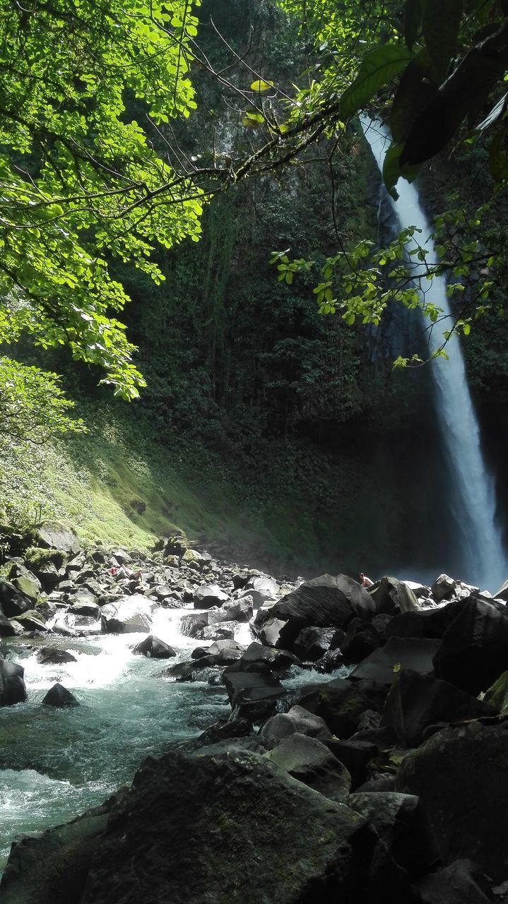 SCENIC VIEW OF STREAM FLOWING THROUGH ROCKS