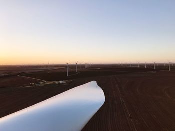 Scenic view of wind turbines on field