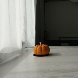 Close-up of orange slice on table at home