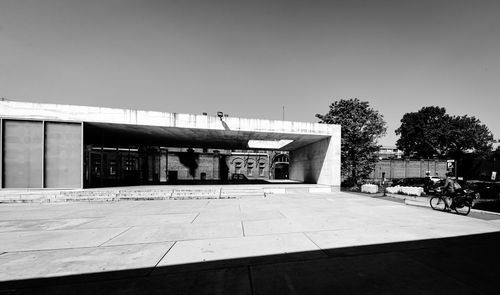 Building by street against clear sky