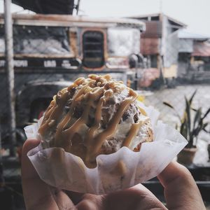 Close-up of hand holding ice cream