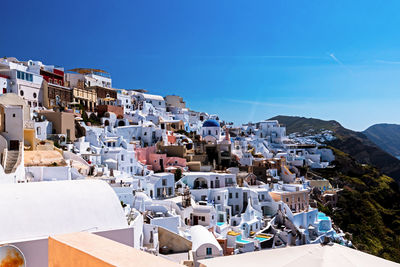 High angle view of townscape against blue sky