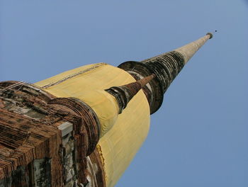 Low angle view of historic buddhist temple spire against clear sky
