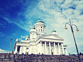 Low angle view of church against cloudy sky